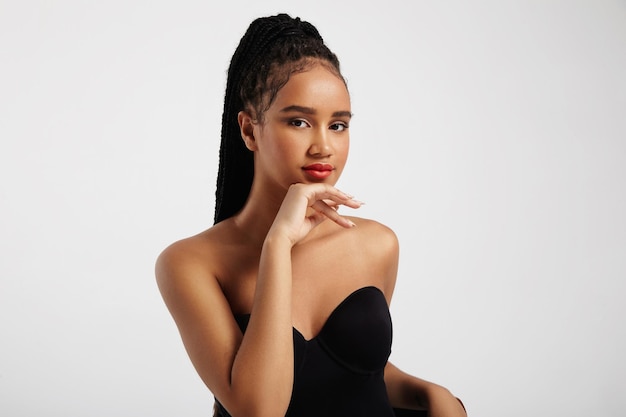 Pretty black woman's portrait wears braids in pony tail