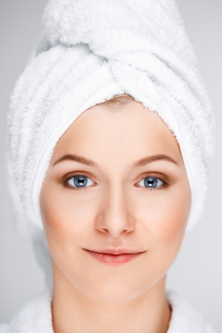 Free Photo pretty blond woman wrap bath towel over wet hair