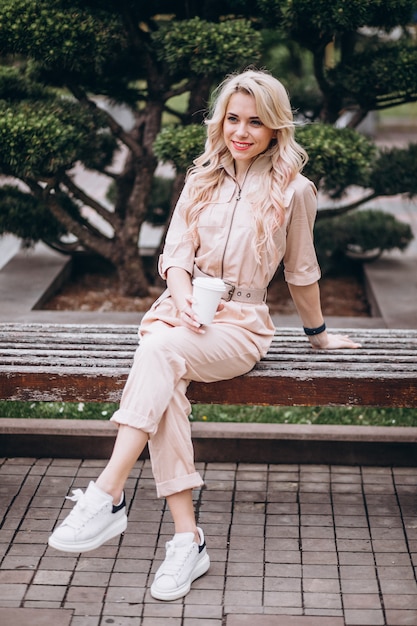 Pretty blonde woman drinking coffee