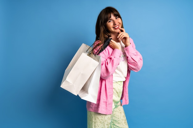 Pretty brunette woman enjoy shopping. stylish image of happy woman