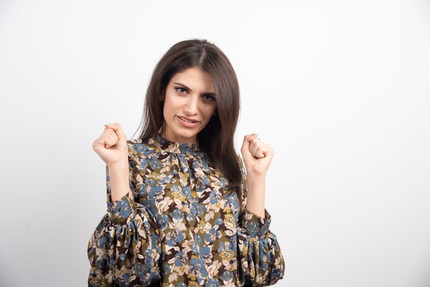 Free photo pretty brunette woman posing on a white background.