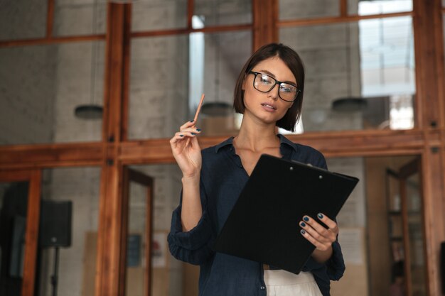 Pretty business woman in eyeglasses