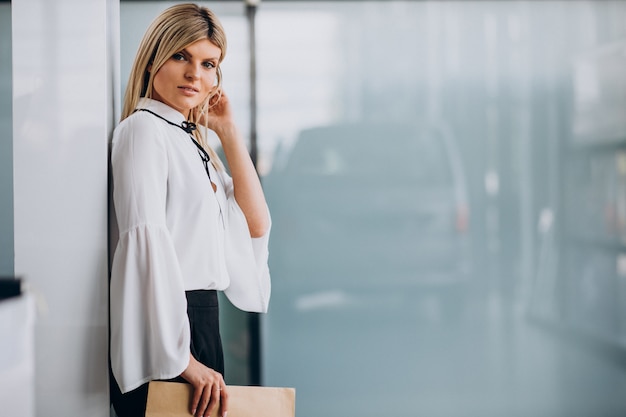 Pretty business woman holding folder