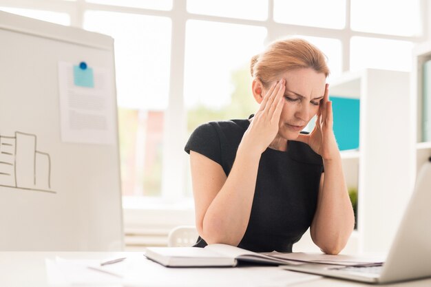 Pretty Businesswoman Having Headache