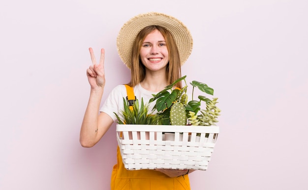 Pretty caucasic woman with plants gardering concept