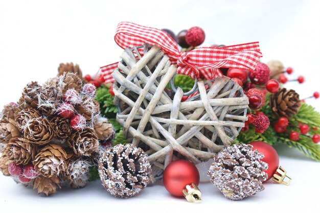 Pretty christmas decoration of heart and pine cones