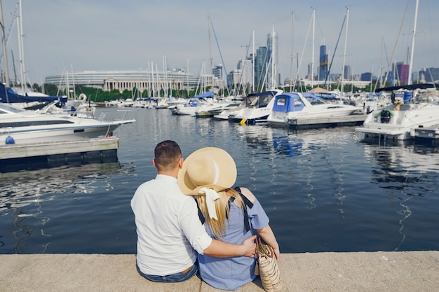 pretty couple standing near water