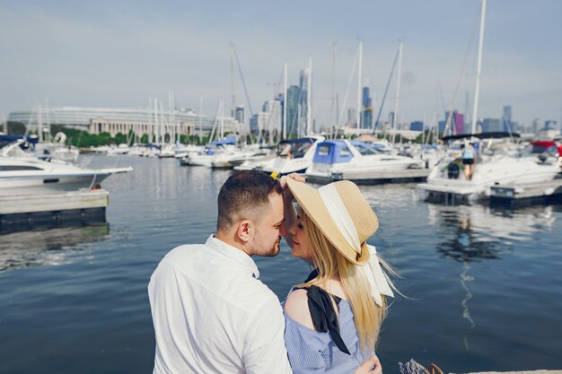 Free photo pretty couple standing near water