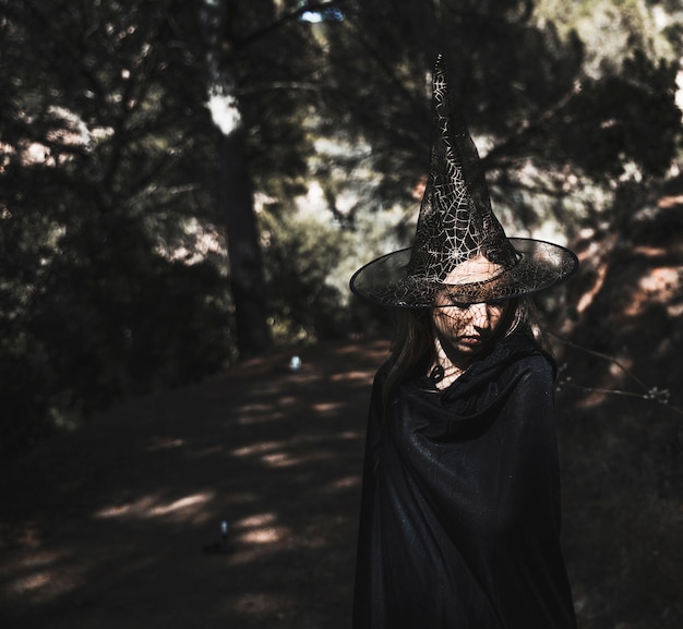 Free photo pretty enchantress  in sunlit thicket