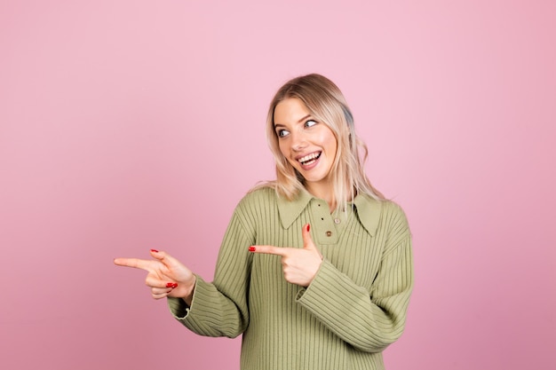 Free photo pretty european woman in casual knitted sweater on pink wall