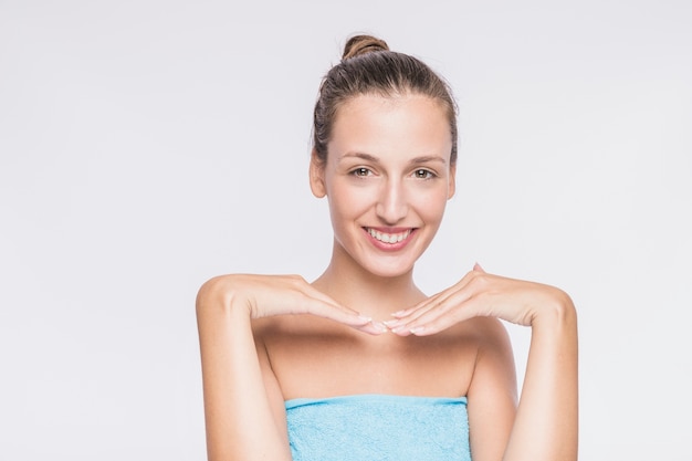 Free photo pretty female in towel on white background