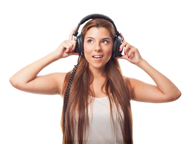 Pretty female with headphones.