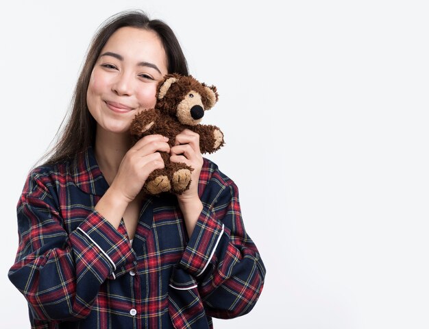 Pretty female with teddy bear