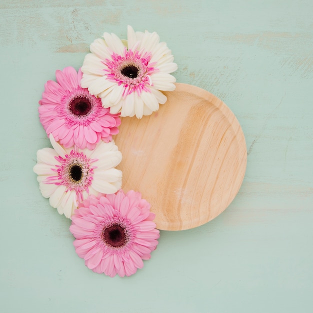 Pretty flowers near plate