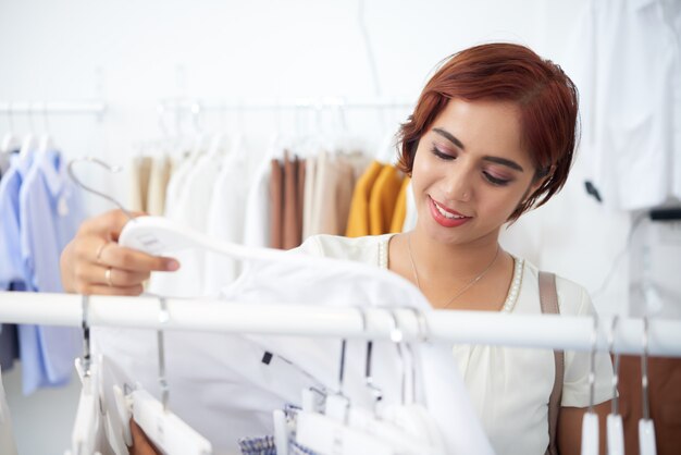 Pretty girl buying clothes