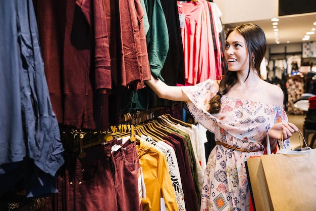 Pretty girl choosing clothes