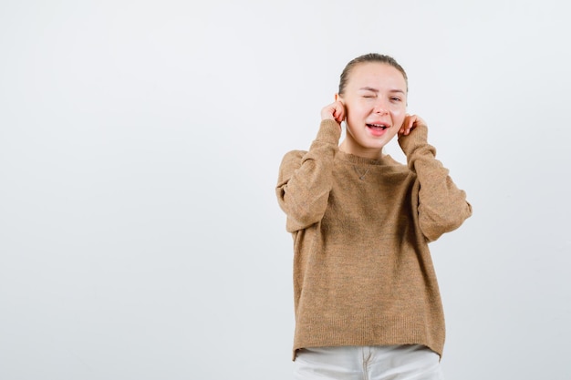 The pretty girl doesnt want hear any gossip on white background