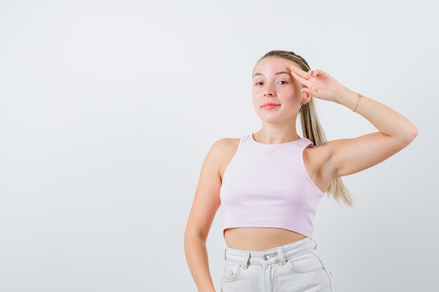 Pretty girl is shooting herself on white background