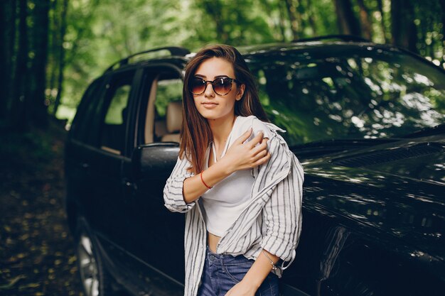 Pretty girl near a car