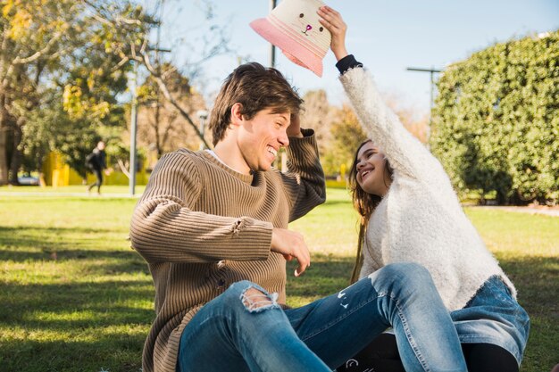 Pretty girl placing hat on her father's head