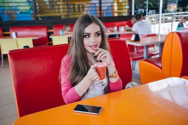 Pretty girl posing with a drink