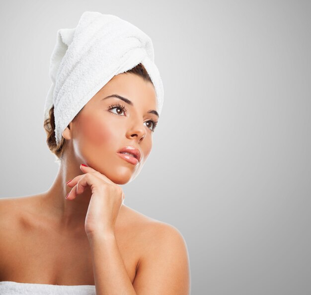 Pretty girl in towel looking away