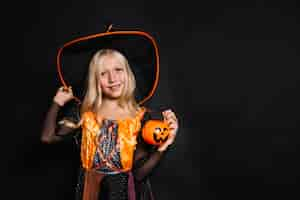 Free photo pretty girl in witch costume