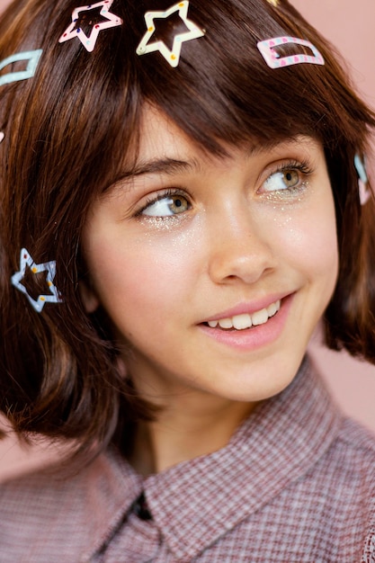 Free photo pretty girl with hair clips