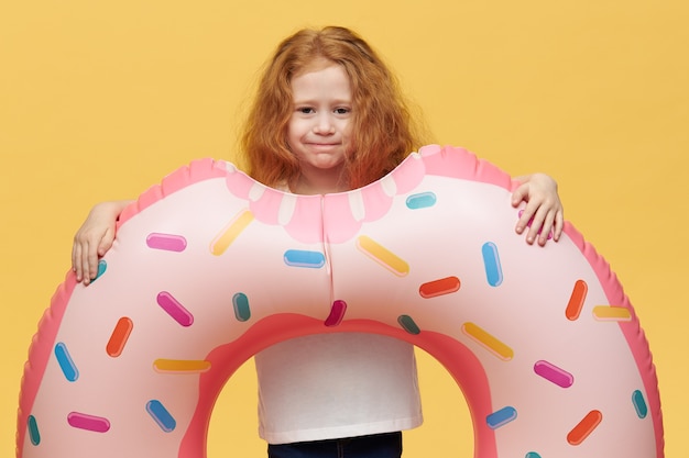 Pretty girl with long hair with inflatable swimming circle