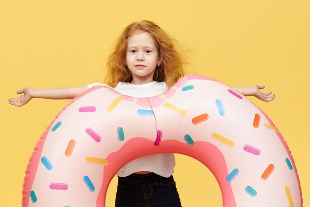 Pretty girl with long hair with inflatable swimming circle