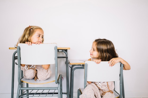 Free photo pretty girls on chairs