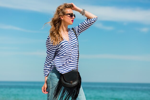 Pretty happiness young woman laughing and having fun on the sunny beach