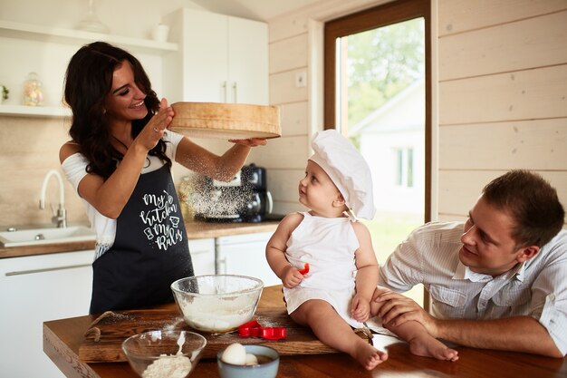 The pretty lady sifting the flour