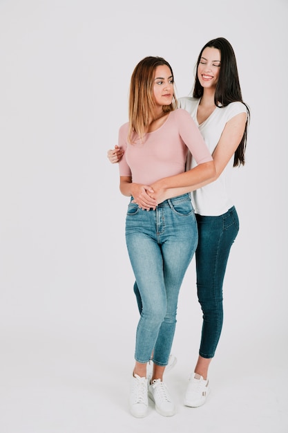 Pretty lesbian couple in studio