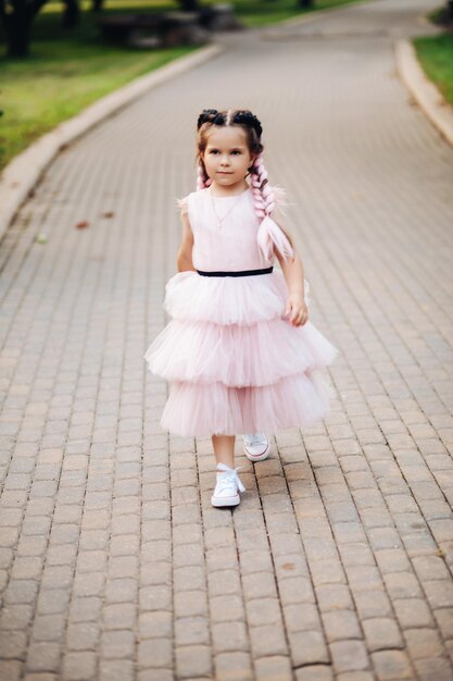 Pretty little girl walking in the park
