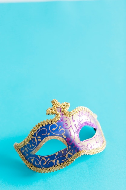 Pretty mask on blue