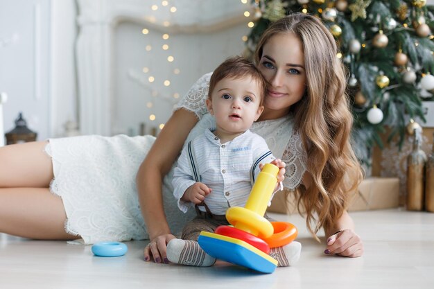 pretty mother and cute baby at home
