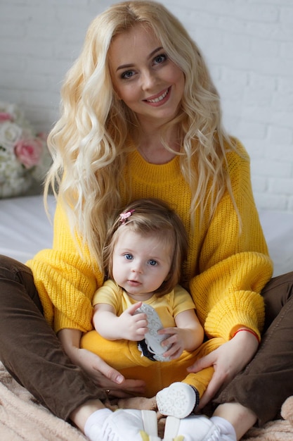 pretty mother and little baby indoor