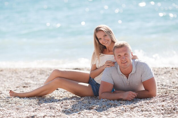 pretty smiling couple woman and man outdoor near sea