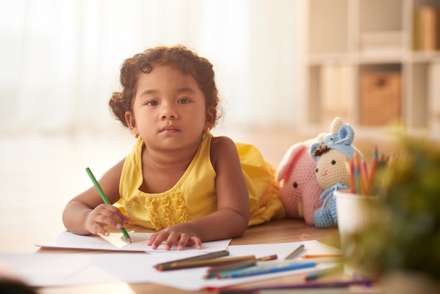 Pretty Toddler Wrapped up in Drawing