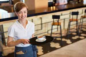 Free photo pretty waitress at work