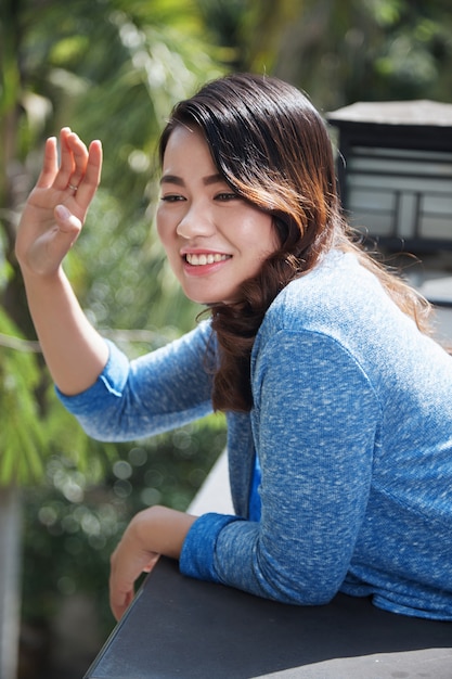 Pretty waving woman