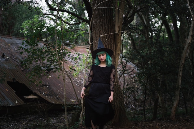 Pretty witch in forest
