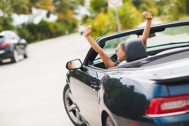 Free photo pretty woman in car