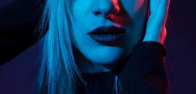 Pretty woman dark lips closeup low light