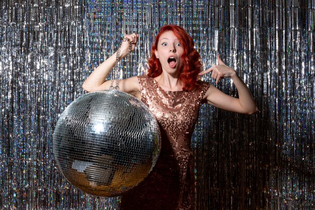 pretty woman in disco party with disco ball