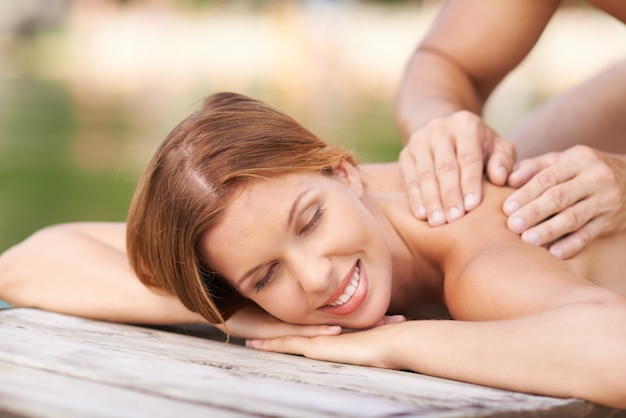 Pretty woman enjoying her massage