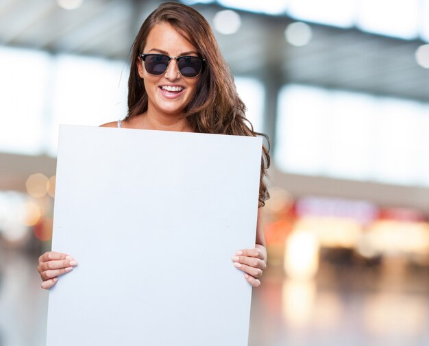 pretty woman holding a banner