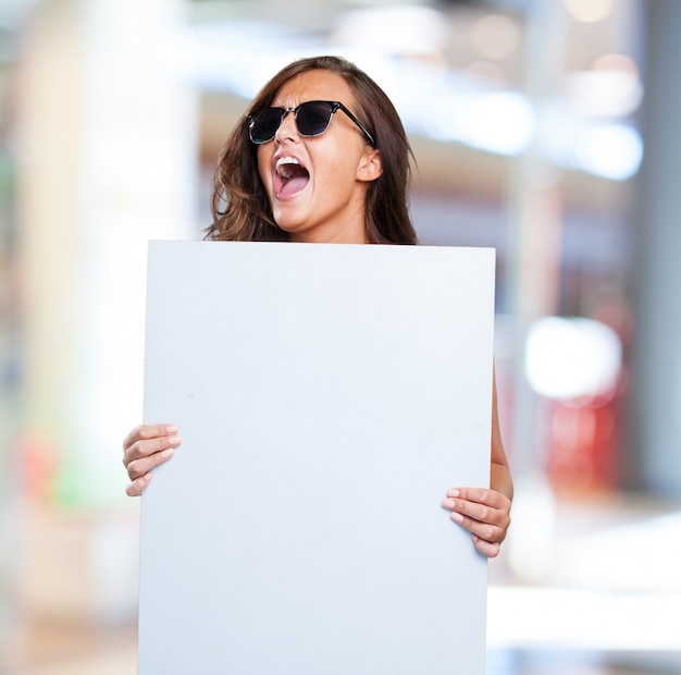 pretty woman holding a banner