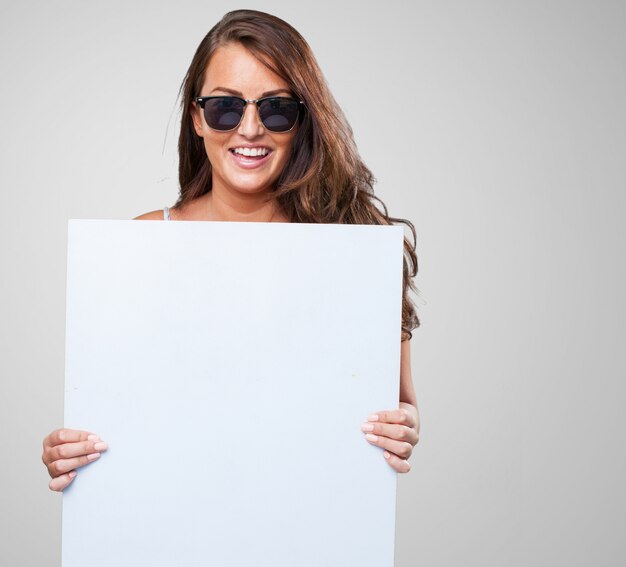 pretty woman holding a banner